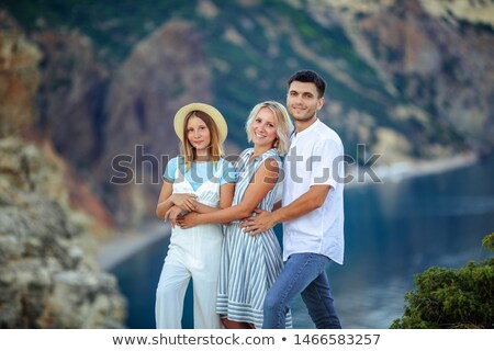 Stock photo: Family Of Two People Mother And Daughter 1 Year Old Against The Background Of The Christmas Tree Pho