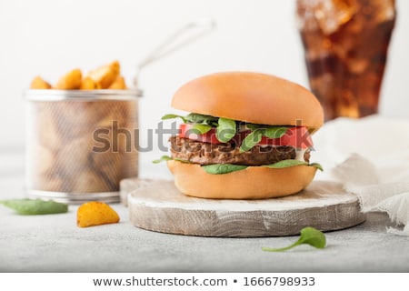 ストックフォト: Healthy Vegetarian Meat Free Burgers On Round Chopping Board With Vegetables On Light Table Backgrou