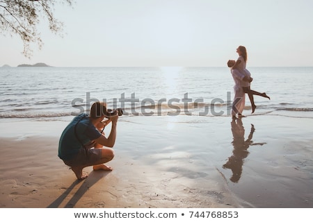 Stock photo: Woman Pointing To A Picture Frame