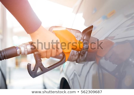 Stock fotó: Gas Station Refill Hand And Nozzle