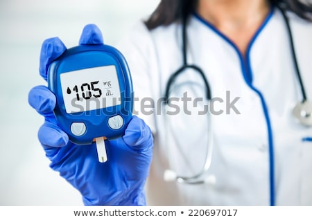 Stockfoto: Doctor Testing A Patients Glucose Level