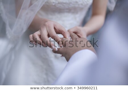 Stockfoto: Beautiful Young Wedding Couple Exchange Wedding Rings