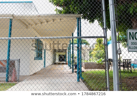 [[stock_photo]]: Building Behind Fence