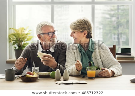 Foto stock: Couple Eating Fruit Salad At Breakfast