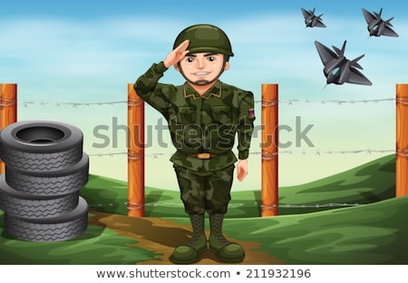 Stock photo: A Soldier In Front Of The Barbwire Fence