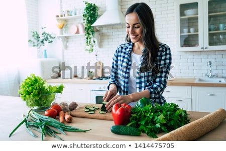 Foto d'archivio: Woman Preparing Food In A Kitchen