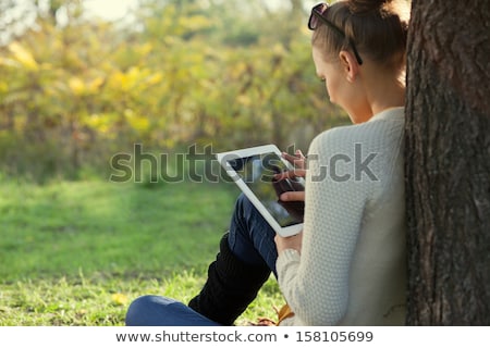 Сток-фото: Girl Reading E Book On Digital Tablet