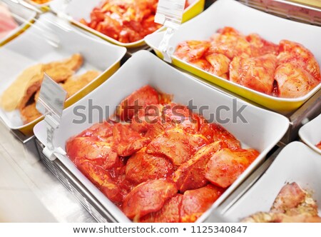 Stok fotoğraf: Marinated Meat In Bowls At Grocery Stall