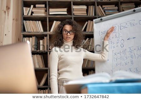 Stock foto: Tutor And College Students Teaching School Work And Explaining P