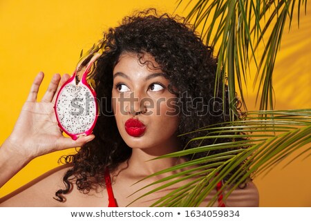 ストックフォト: Lady In Swimwear Holding Exotic Fruit Blowing Kisses