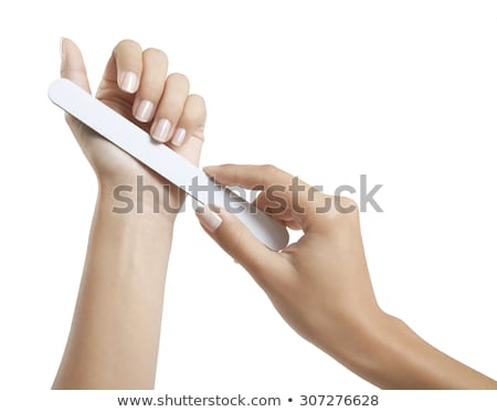 [[stock_photo]]: Woman Filing Fingernail