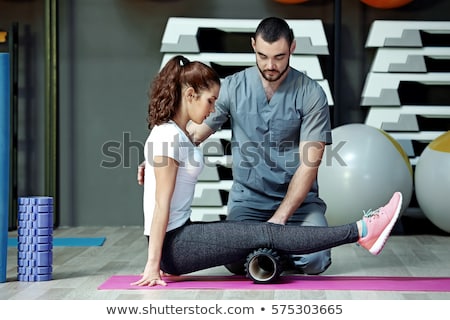 Stockfoto: Physiotherapist Doing Sport Rehabilitation With Patient