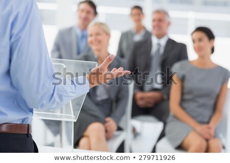 Stockfoto: Stylish Young Businessman Doing A Presentation
