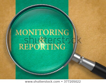 ストックフォト: Monitoring And Reporting Through Lens On Old Paper