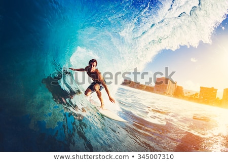 Foto stock: Man Surfing A Wave
