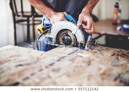 Zdjęcia stock: Construction Tool Power Saw In Male Hand