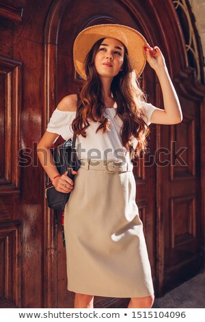 Сток-фото: Young Woman In A Hat With Handbag