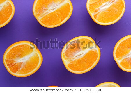 Zdjęcia stock: An Organice Grapefruit On Purple Background