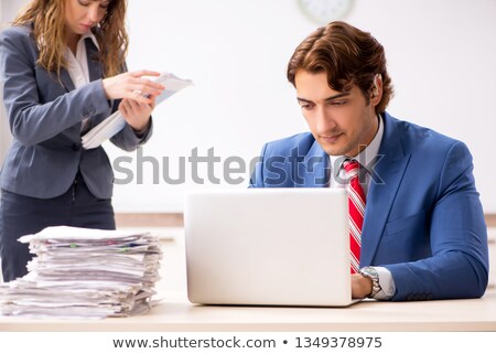 Stok fotoğraf: Deaf Employee Using Hearing Aid In Office