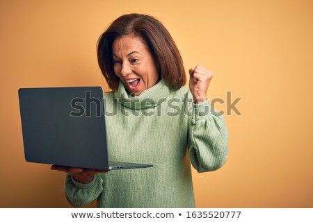 Foto stock: Triumphant Woman With A Laptop