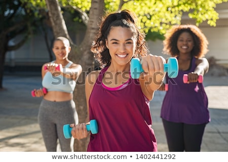 ストックフォト: Overweight Woman Exercising On Trainer
