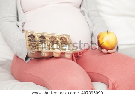 Foto stock: Woman Eating Chcolate