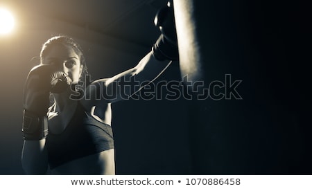 Imagine de stoc: Fitness Woman Wearing Boxing Gloves