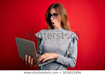 Stock fotó: Young Brunette Businesswoman With Glasses Is Shocked Laptop