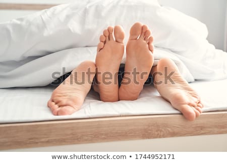 ストックフォト: Young Passionate Couple Making Love In Bed