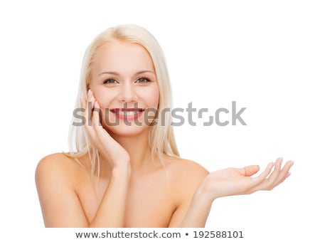 Stok fotoğraf: Smiling Woman Holding Imaginary Lotion Jar