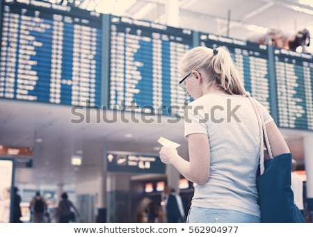 Zdjęcia stock: Woman Looking At Departure Board