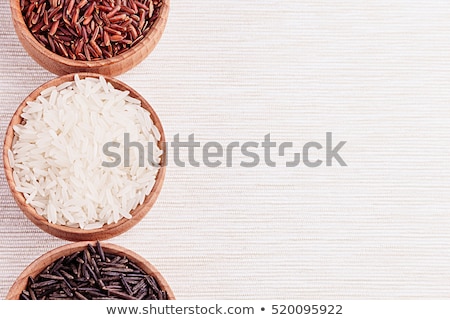 Foto stock: Red Black And White Rice Close Up In Wood Bowls On Beige Fabric