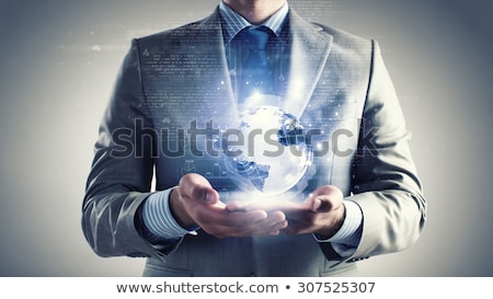 ストックフォト: Close Up Of Businessman Hand With Earth Hologram