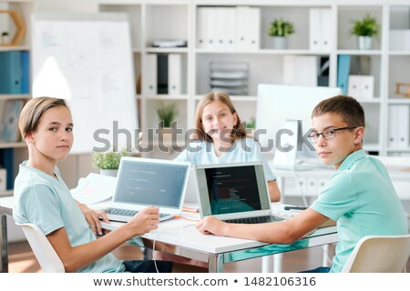 [[stock_photo]]: Group Of Clever Middle School Students Looking At You In Classroom