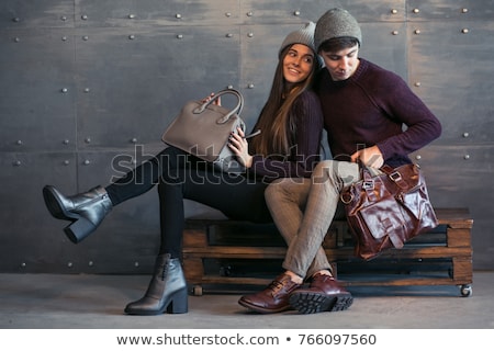 Stockfoto: A Man And A Woman With Bags