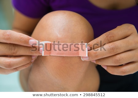 Foto stock: Plaster On A Womans Knee