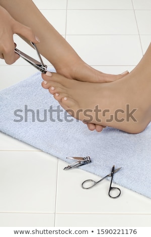 Stock photo: Side View Of A Young Woman Receiving Pedicure Treatment