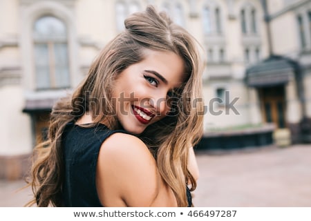 Stockfoto: Portrait Of A Beautiful Young Woman Wearing Black Dress