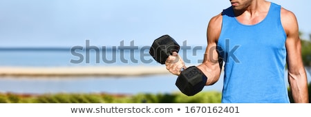 Stockfoto: Bicep Curl - Weight Training Fitness Man Outside Working Out Arms Lifting Dumbbells Doing Biceps Cur