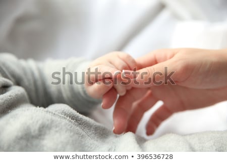 Stock photo: Close Up Of Mother With Little Baby Boy At Home