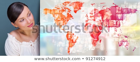 ストックフォト: Portrait Of Young Woman Standing In Fron Of Big World Map And Lo