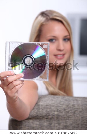 Сток-фото: Portrait Of A Woman Holding Cd