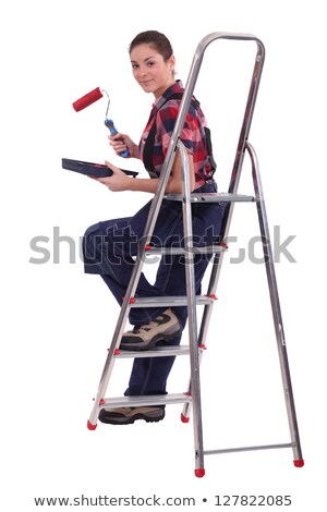 Stockfoto: Craftswoman Painter Holding A Brush And A Can