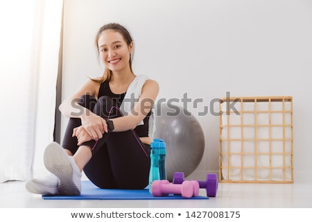 Foto stock: Beautiful Asian Woman Exercising With Dumbbells