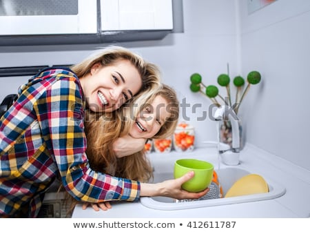 Stock photo: Beautiful Blond Young Woman Drinking Water From Tap