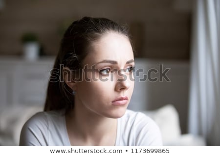 Foto stock: Portrait Of A Frustrated Young Woman Looking Away
