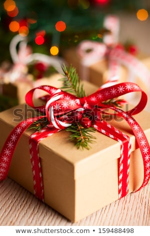Foto stock: Christmas Gift Boxes Candles And Fir Tree Branch