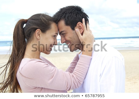 Cute Loving Couple Hugging On The Beach Outdoors Imagine de stoc © mangostock