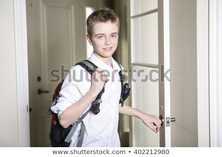 ストックフォト: Teen Coming Home Passing Through The Door