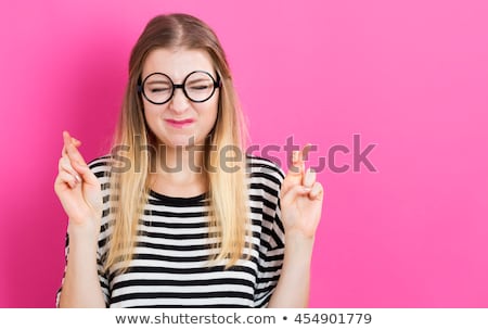 Stock photo: Woman Crossing Fingers